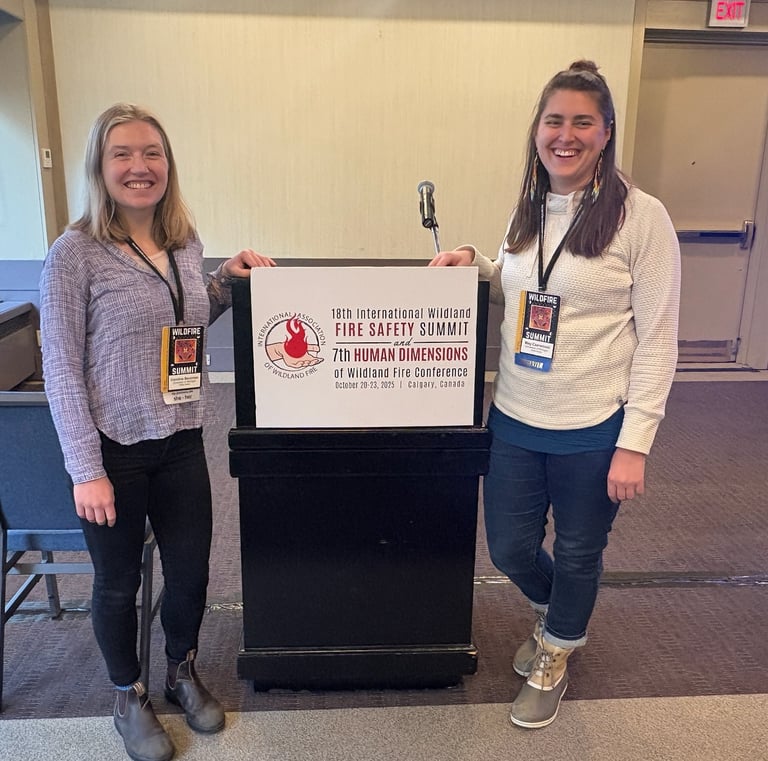Two people standing in front of a podium