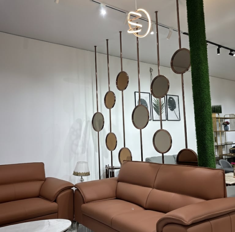 Contemporary brown leather sofa set at furniture showroom in Bengaluru