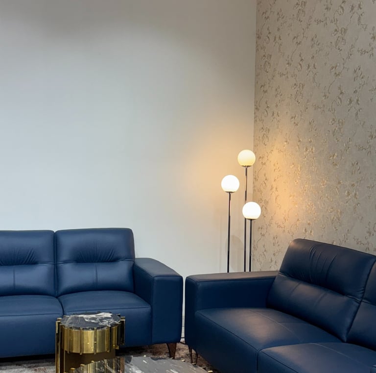 Premium blue leather sofa set at furniture store in Bengaluru