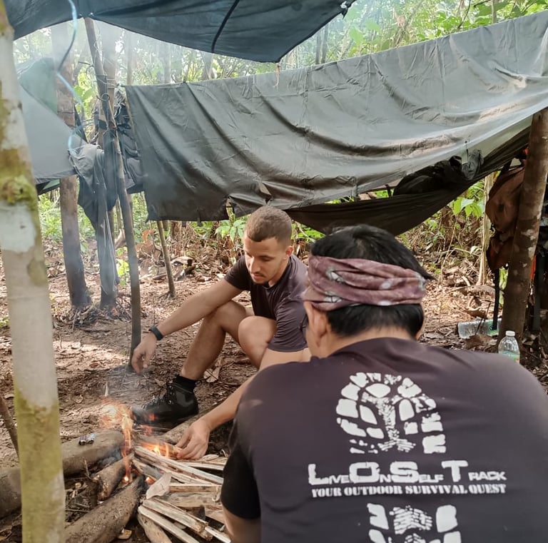 a group of people sitting around a campfire