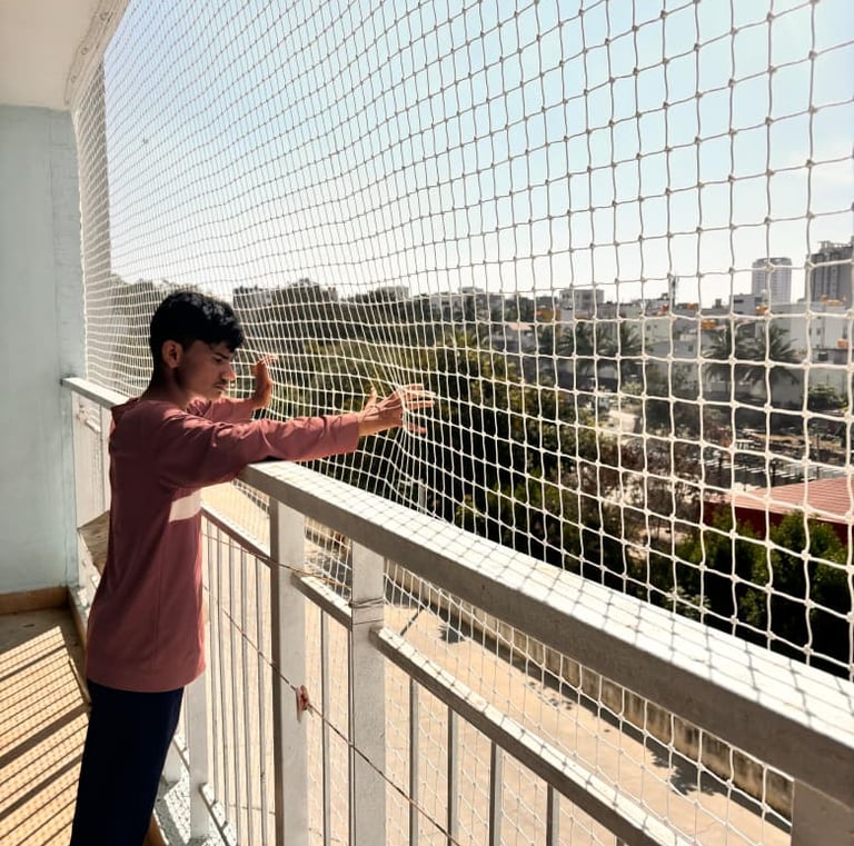 High-rise balcony safety net installation by Arjilli Safety Nets in Cuffe Parade, Mumbai with unobtr