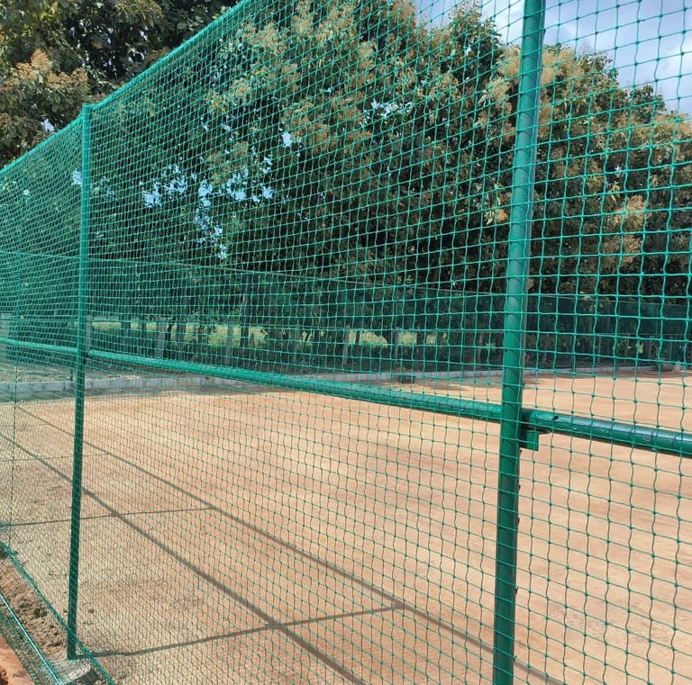 Close-up of a sturdy sports net tightly secured on a cricket practice area in Mumbai