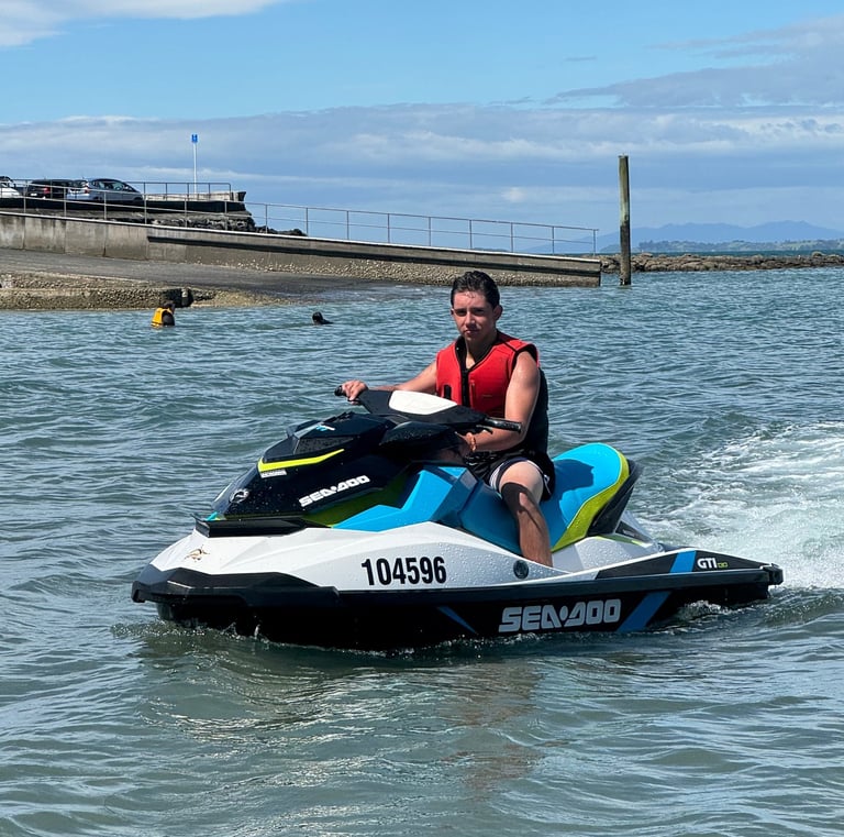 a happy renter enjoying riding on one of our jetski