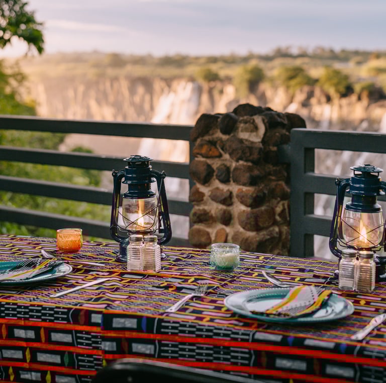 Guests enjoying authentic Zambian dining experiences at Moonbow Gatherings near Victoria Falls