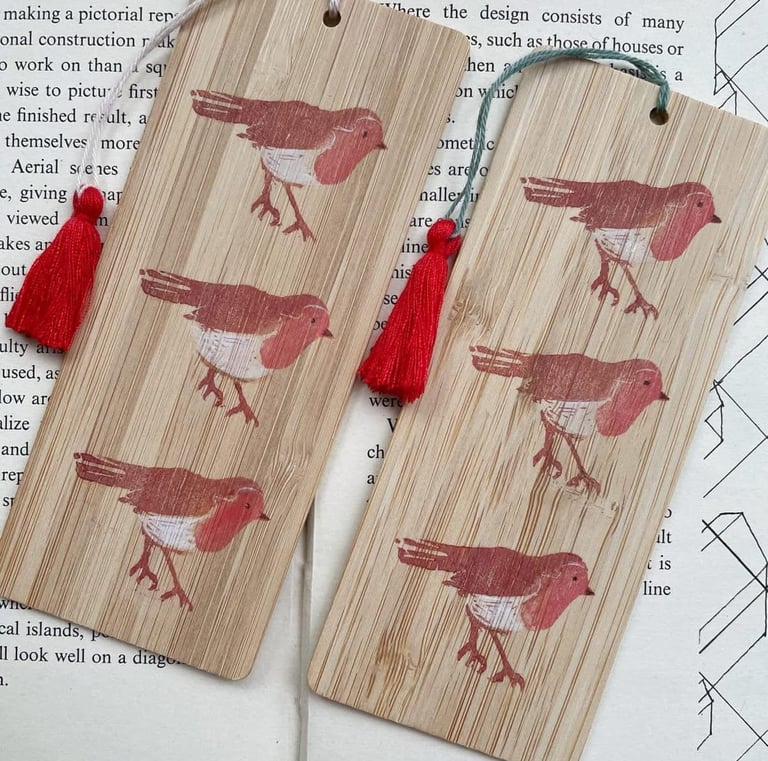 A pair of wooden bookmarks with handmade lino print of robins