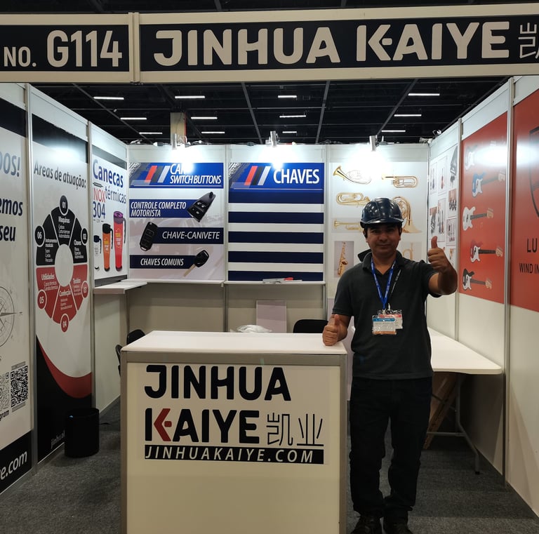 a man standing in front of a booth at a trade show