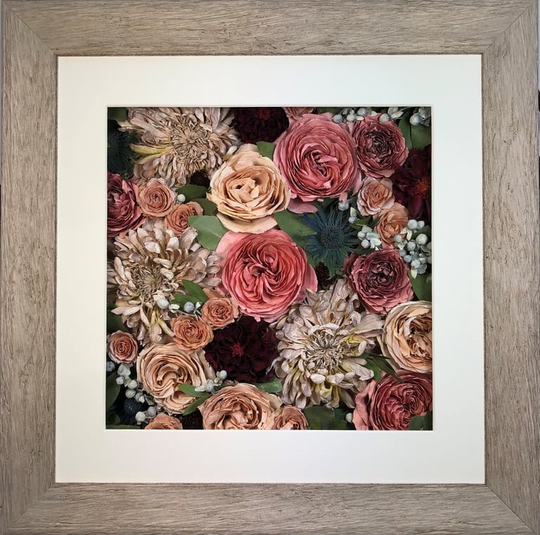 a flower wall preserved wedding bouquet in a frame