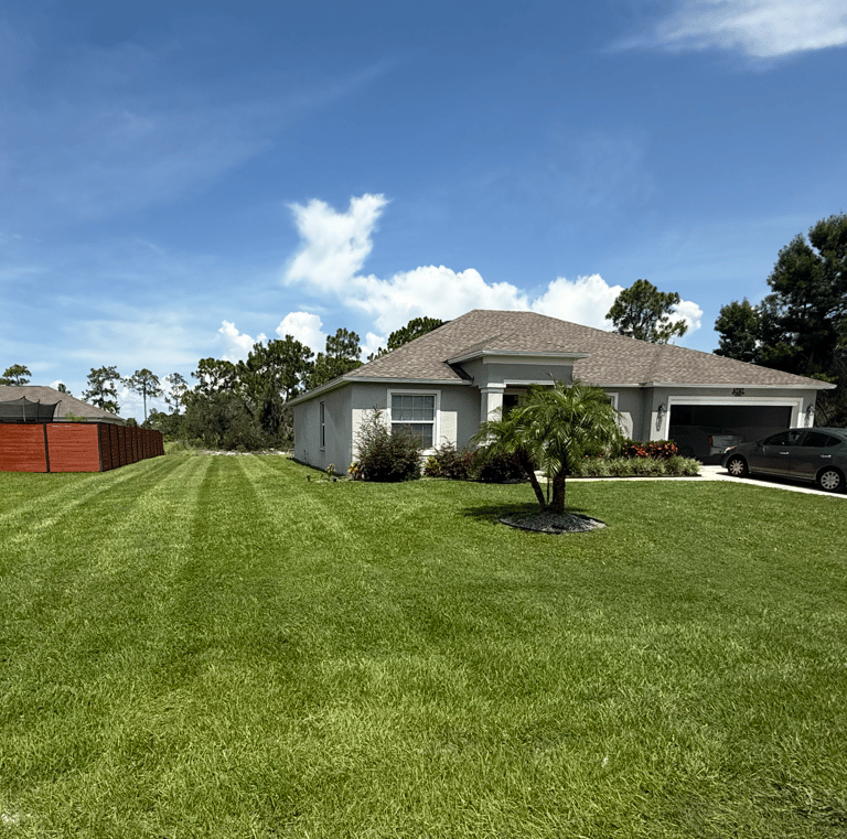 a house with a car parked in the grass sebring florida