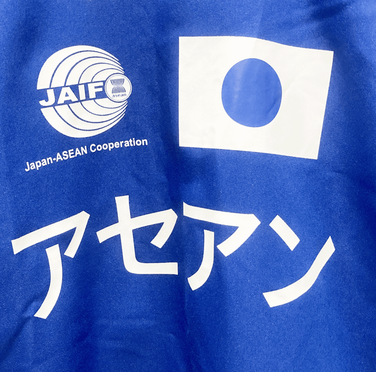 a blue shirt with japanese flags and a blue shirt with the words support the alliance