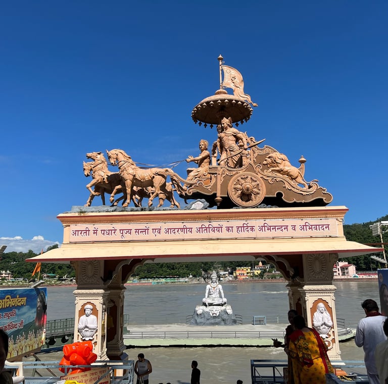 Statue of a Shri Krishna and Arjun on rath at Parmarth Ashram in Rishikesh, near the Ganges River
