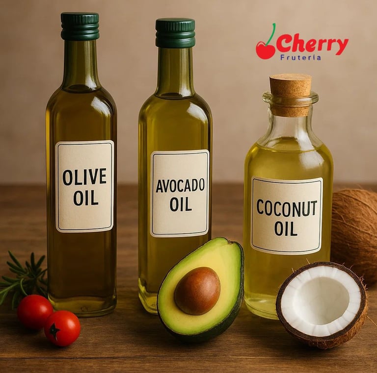 – Botellas de aceite de oliva, aguacate y coco en una mesa.