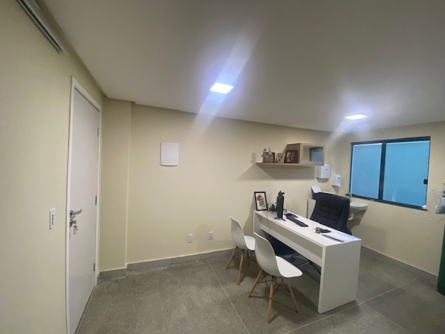 a desk with a laptop and a laptop on it