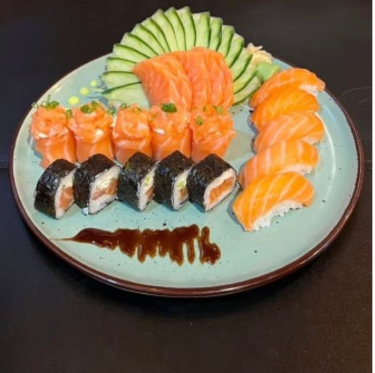 a plate of sushi with a variety of sushi