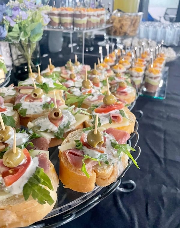 a tray of food with olives and olives