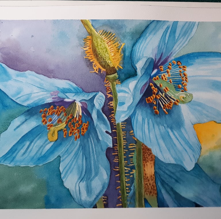 a watercolor painting of a blue hyacinth flower on a table with paintbrushes