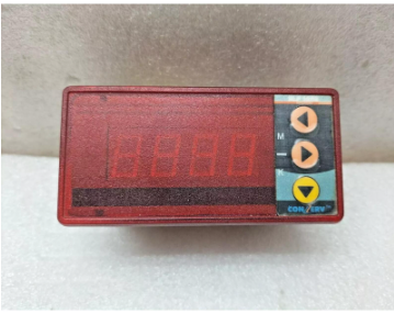 A Con-Serv industrial digital power meter with a red LED display and control buttons.