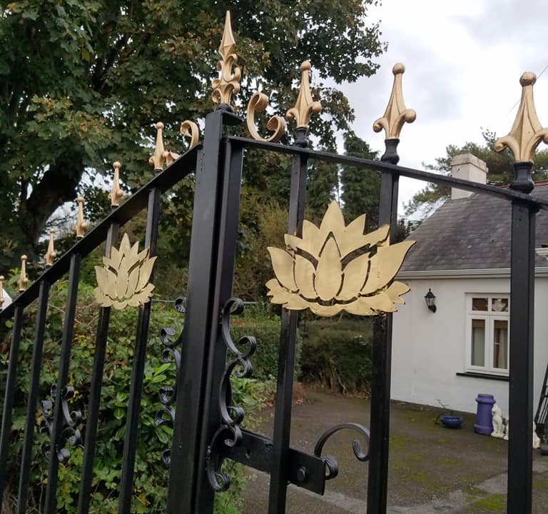 Golden spear top gates with floral design