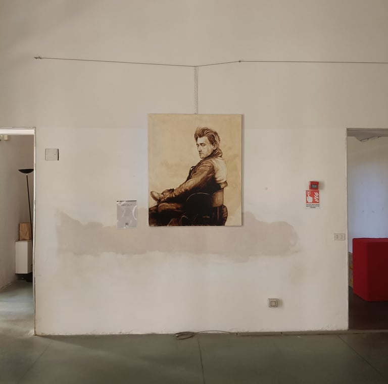 A sepia-toned portrait painting of Antonin Artaud a white gallery wall in a minimalist art studio.