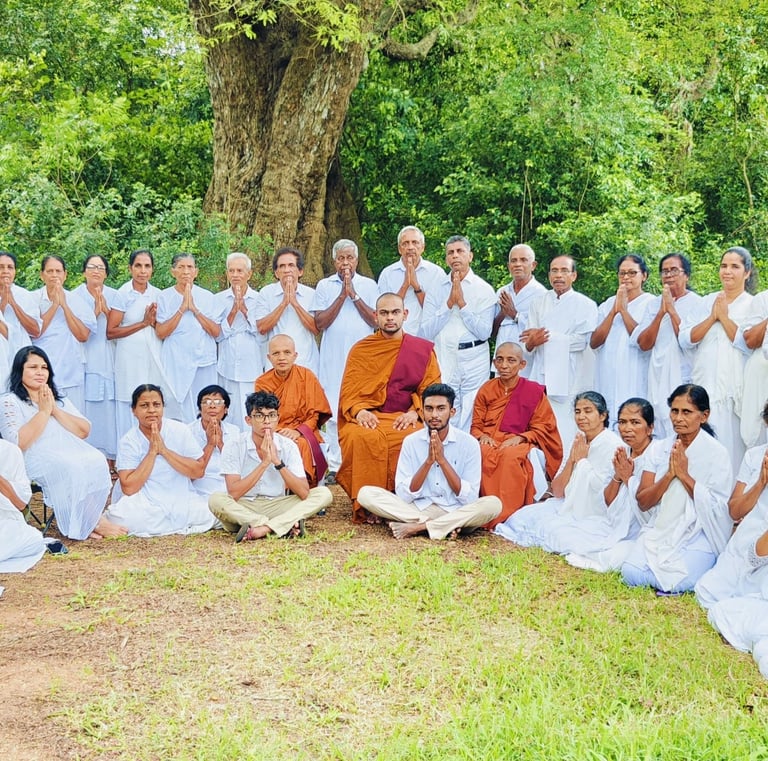 a group of people standing in front of a tree