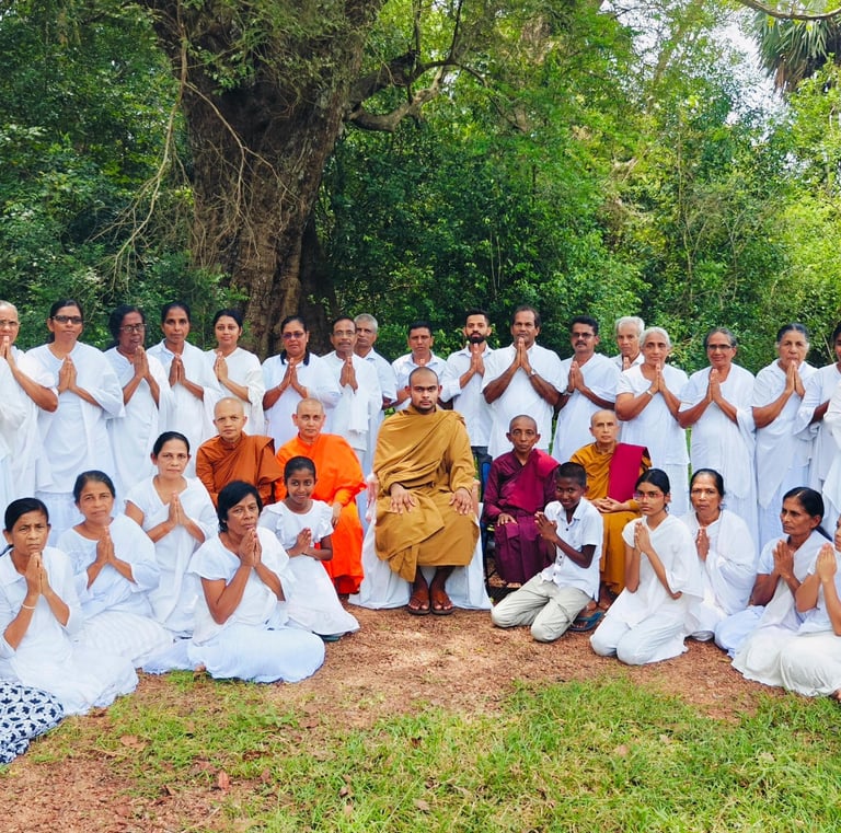 a group of people standing in front of a tree