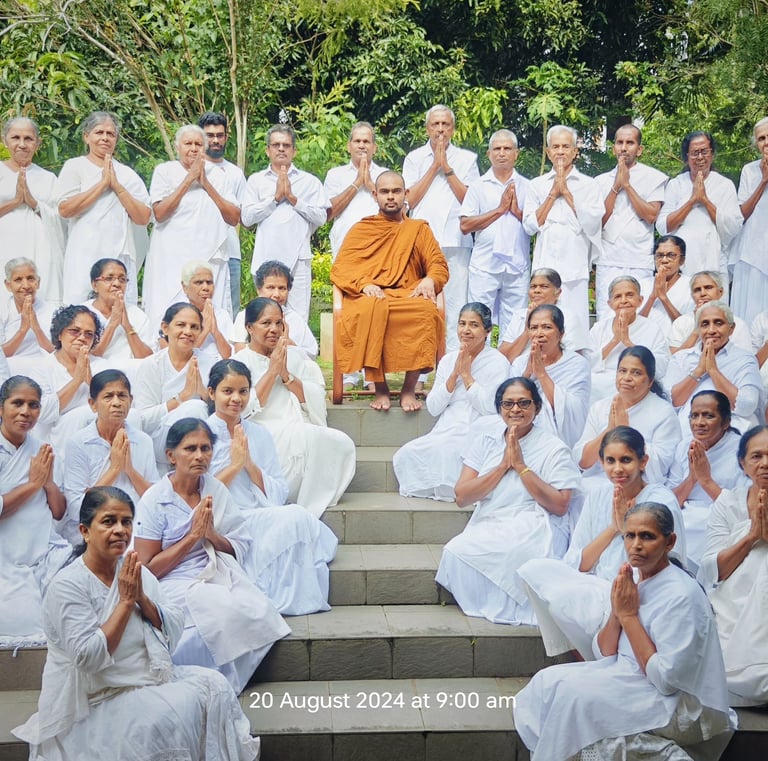 a group of people sitting on steps with their hands up