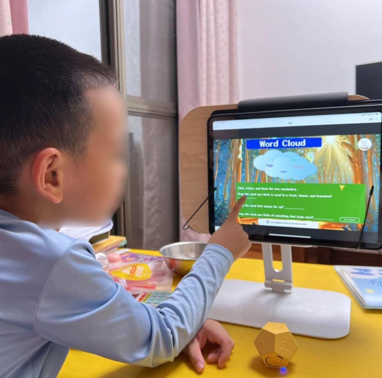 a young boy playing a video game on a computer