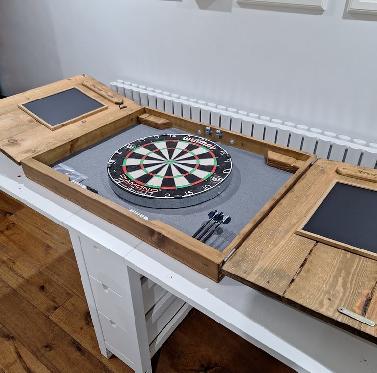 a dart board in a dart board cabinet