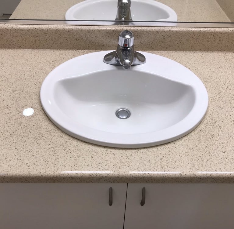 Bathroom countertop reglazing with modern finish