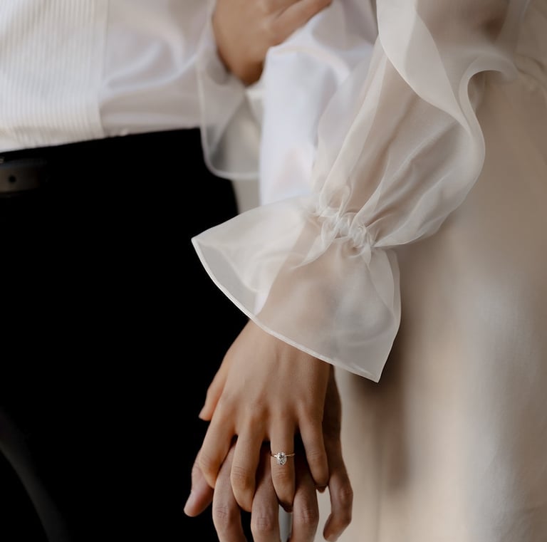 bride and groom detail holding hands