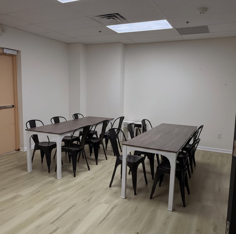 Empty event room with table and chairs