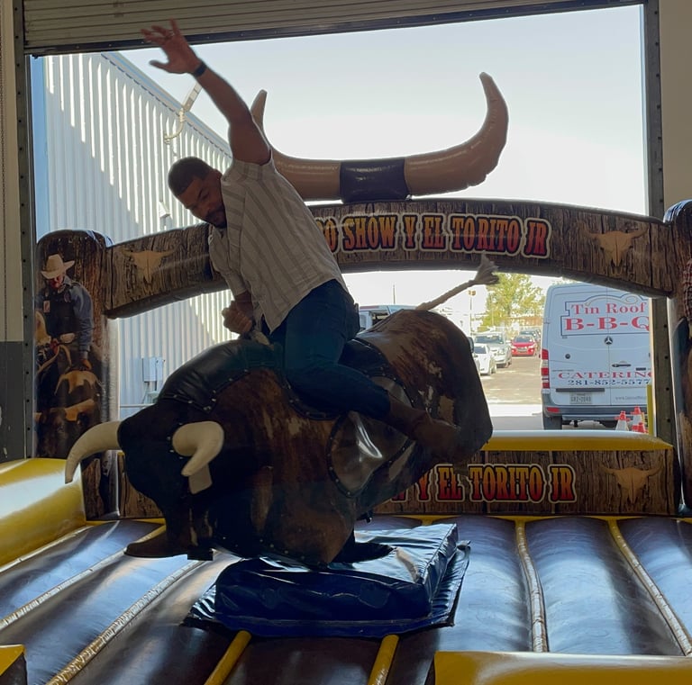 man riding mechanical bull