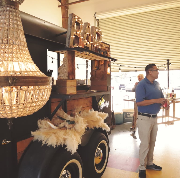 horse trailer bar with men in front