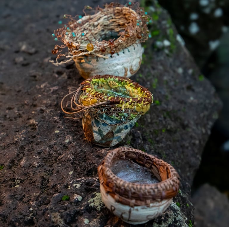 a collection of 3 woven top ceramic bowls