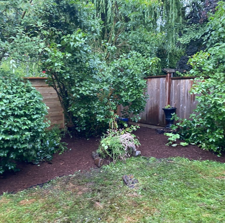 mulched flower bed with rocks