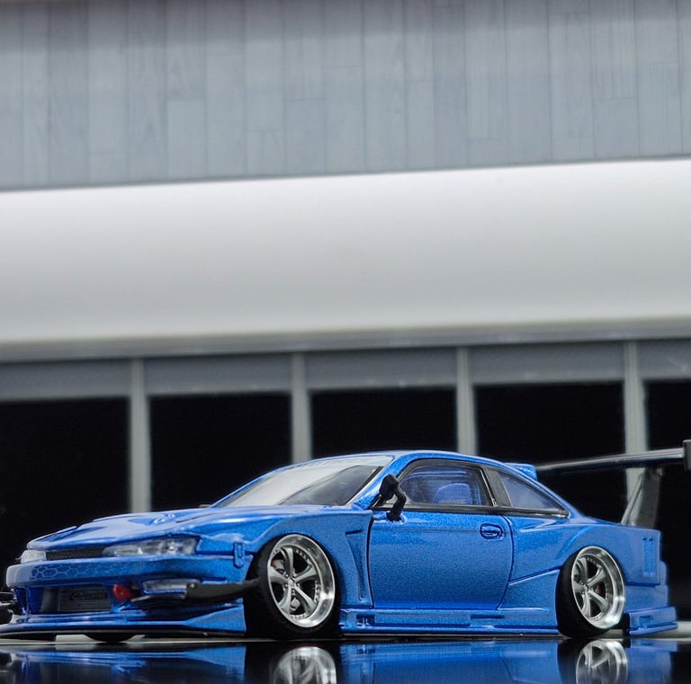 closeup photo of 1/64 mortal model of Nissan Silvia S14