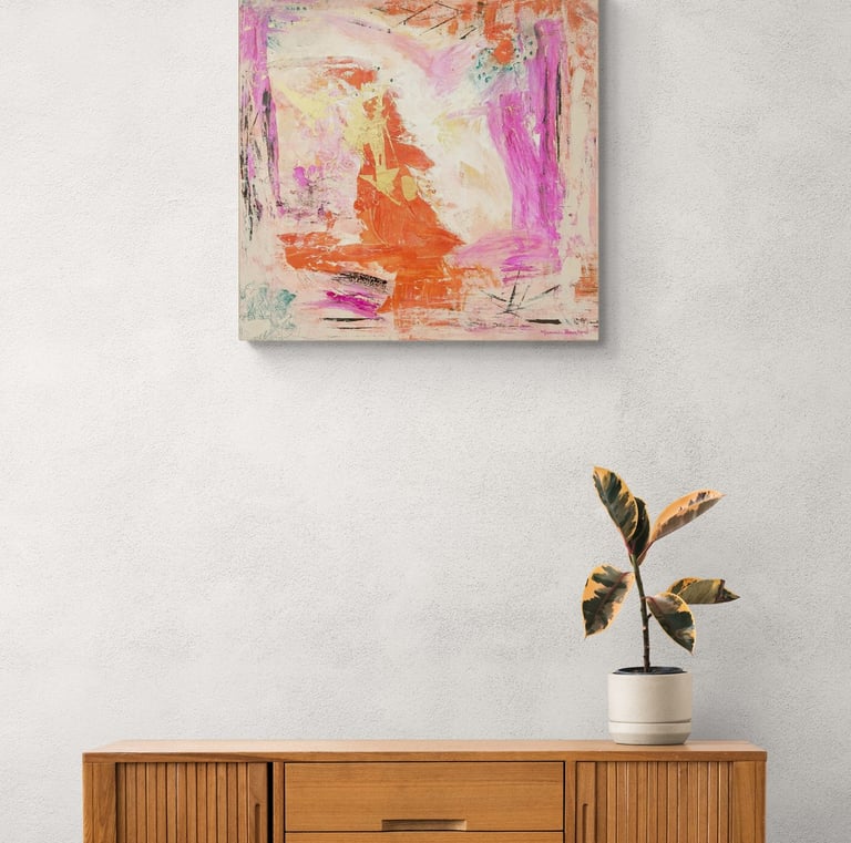Painting called Cathalina in warm orangy and pink colors on wall above a wooden cabinet