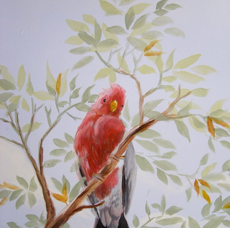 A ceiling mural showing a cockatoo sitting on a leafy branch looking down