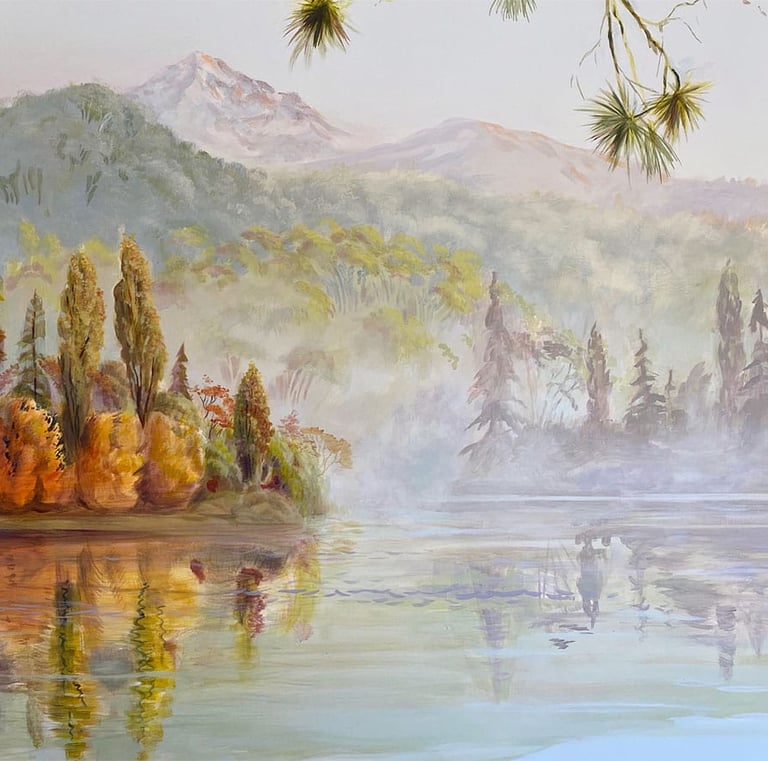 Close-up of New Zealand-inspired mural with foggy lake, peninsula, and misty mountains.