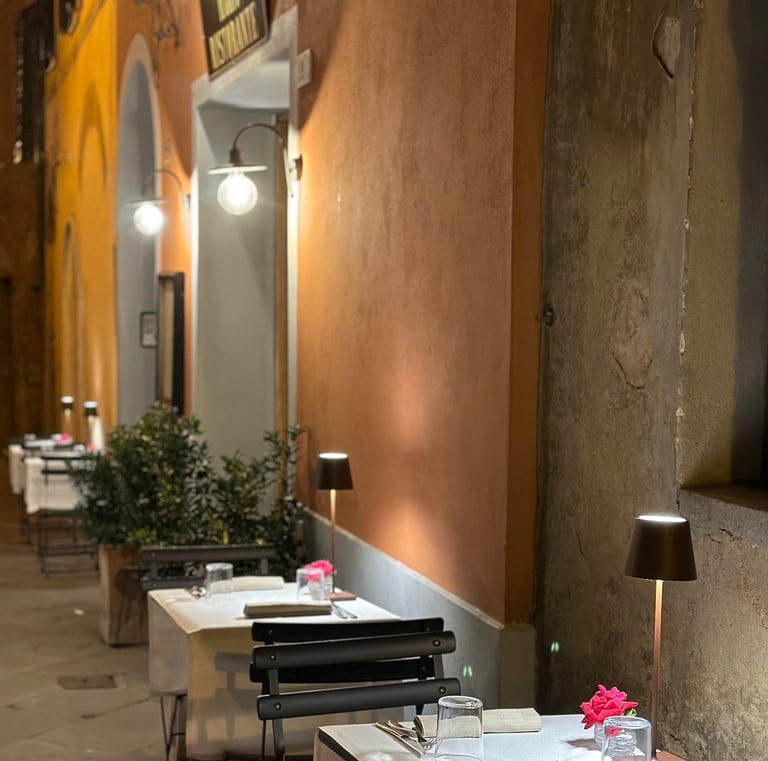 a restaurant with tables and chairs and a lamp