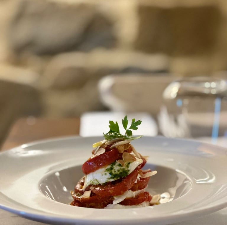 a plate of food on a table with a glass of water