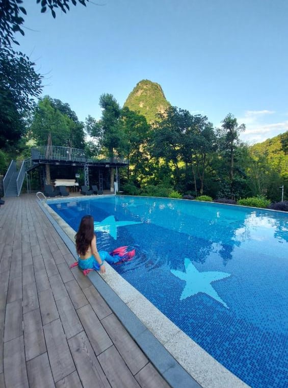 Imagine winding down in the pool by the Li River and taking in the stunning scenery of Yangshuo