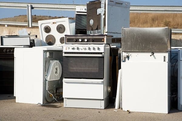 old appliance piled at recycling center