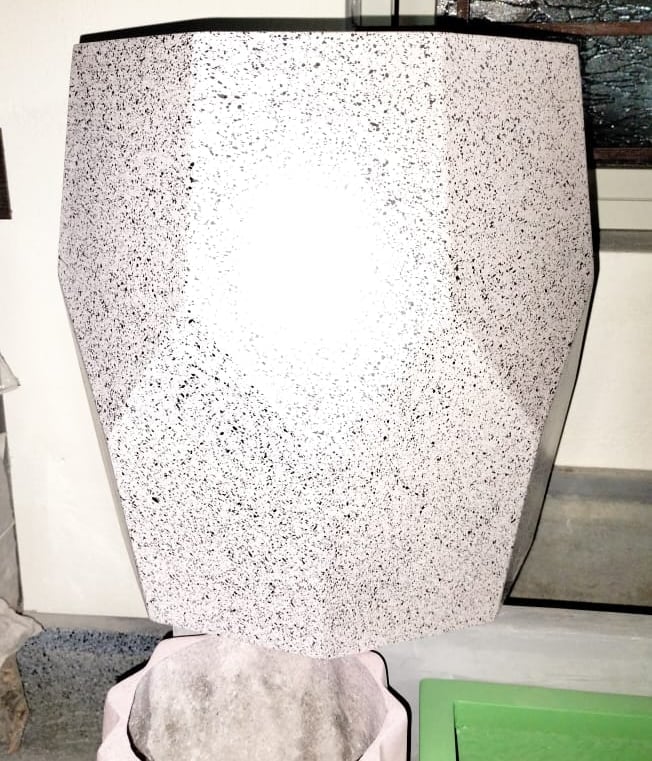 a toilet with a white toilet paper towel