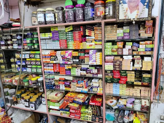Shelves in a local shop stocked with various incense sticks, fragrance oils, and traditional aromatic jars.