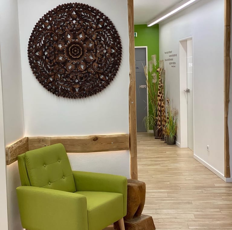 a green chair in a room with a wooden floor