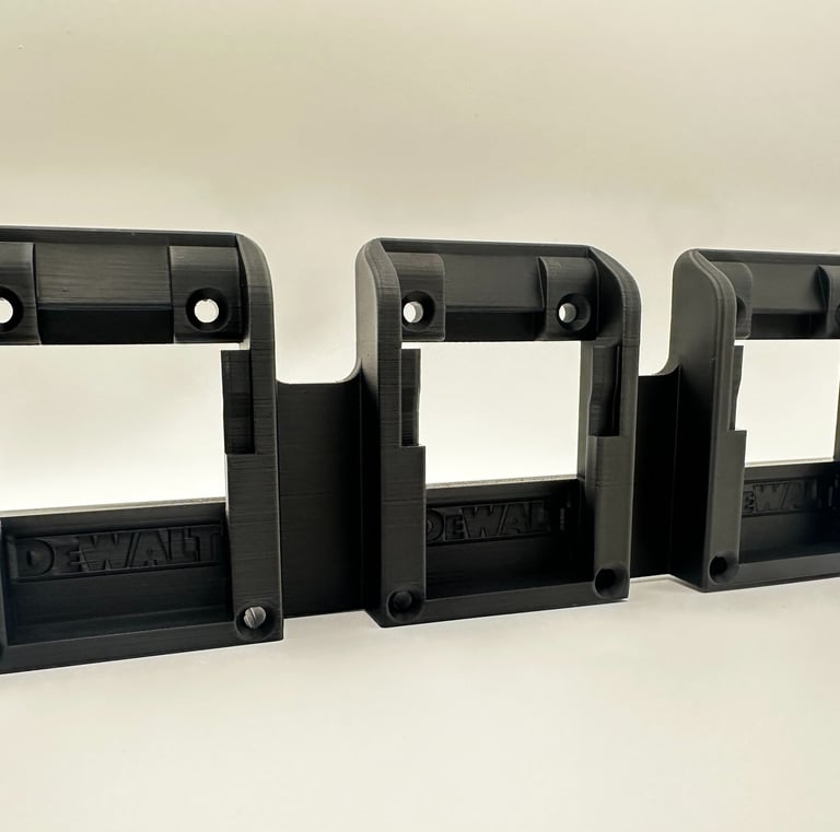 Black 3D printed triple battery wall mount organizer for DeWalt 20V power tool batteries.