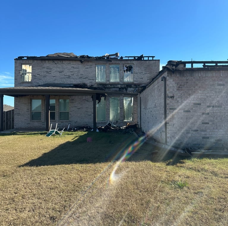 lightning fire damaged home side view Sunnyvale TX - Irvin Restoration complete structural rebuild DFW