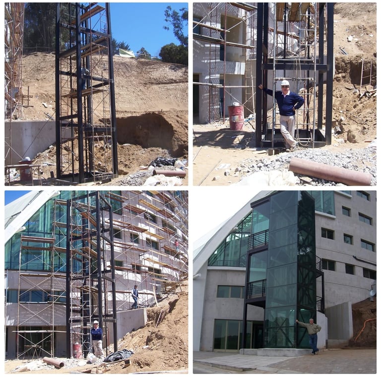 a man standing on a ladder to get a picture of a building