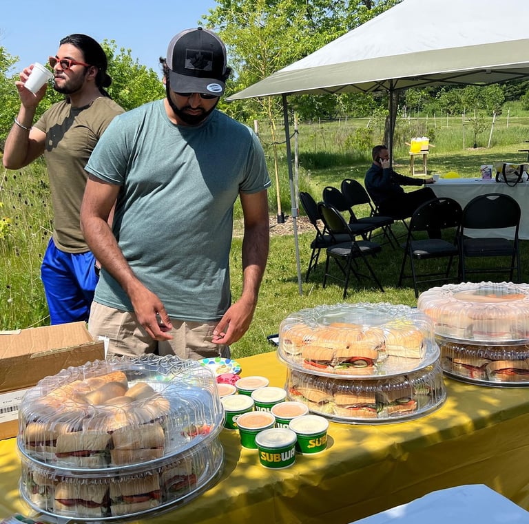 A Baig Security Employee getting a food at the table
