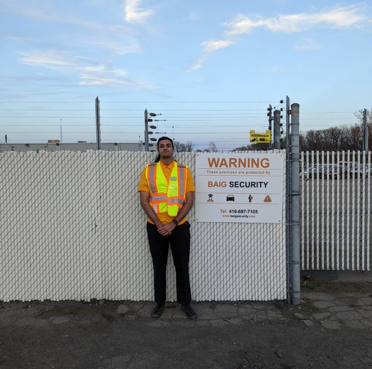 Male Security Guard Guarding the Gate